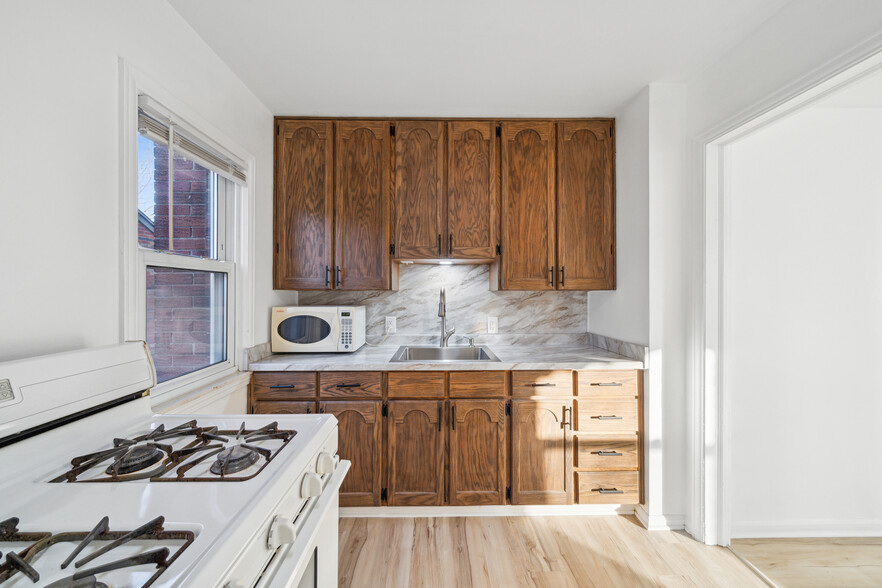 Kitchen. Appliances to be updated prior to move-in. - 16079 Forest Ave