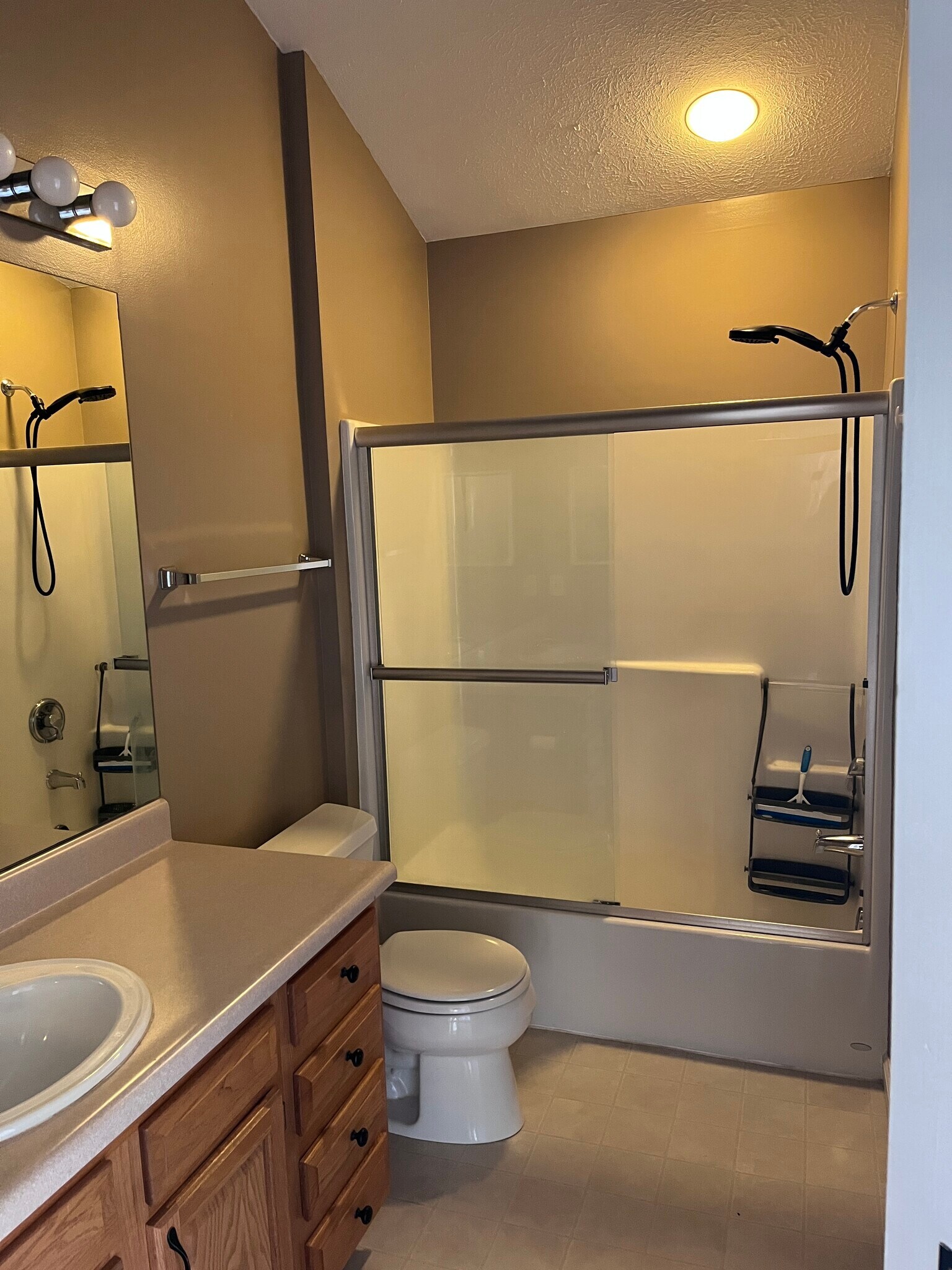 Bathroom with tub shower and glass doors - 304 Berrington Ct