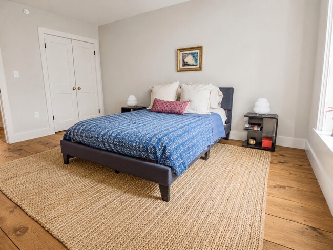 Bedroom with Wide-Plank Floors - The Granite Building