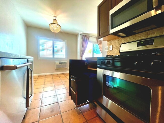 Pull out trash/recycling, new microwave and light fixture - 1325 Wellesley Ave