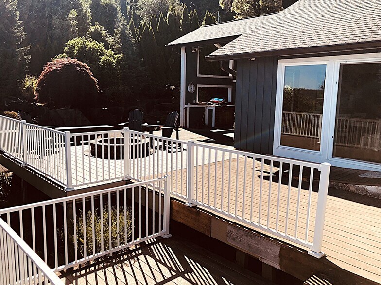 Decks across the front with covered patio to the side - 7107 120th St NW