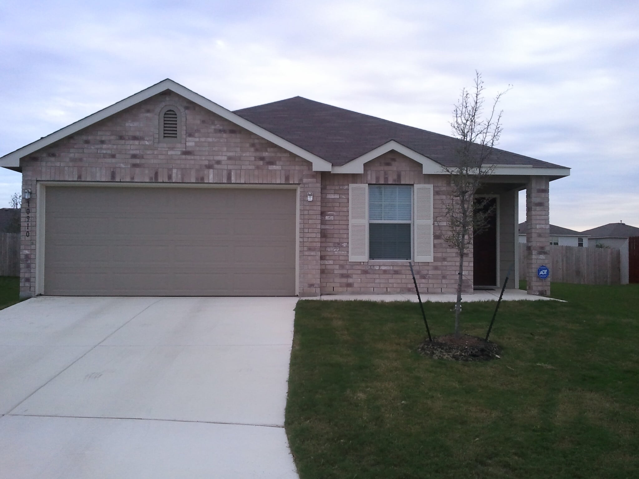 Entrance w/ 2-car garage - 10910 Burning Lamp