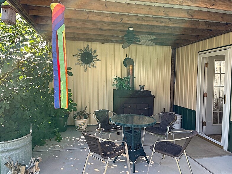 Private side porch. Relax with your morning coffee for sunrises or toast marshmallows at night. - 31312 Rd 280B