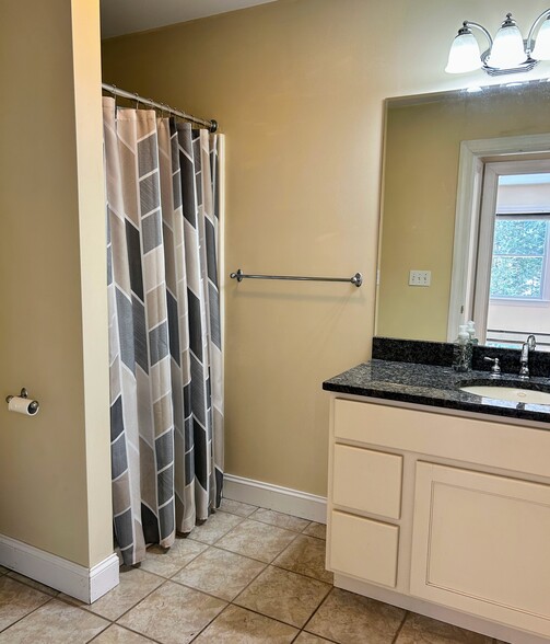 Bathroom with shower and marble counter - 4 Evergreen Dr