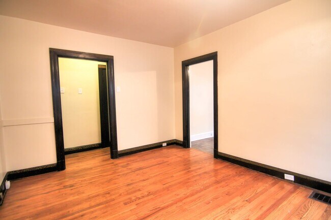 Building Photo - This 2 bedroom 1 bath home has been completely refinished with brilliant hardwood floors throughout!