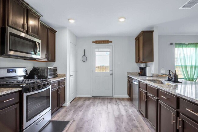 Building Photo - ASK ABOUT FREE APPLICATION FEES THROUGH AUGUST!  PRICE REDUCED!! Landscaping Included! Charming 3...