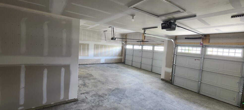 Three car garage gives ample space for extra storage along with all the cars your family owns. - 8985 Hawk Hill Way