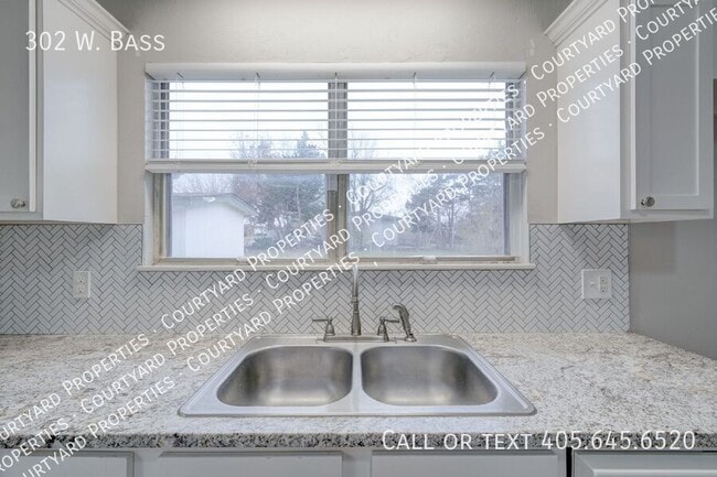 Building Photo - 302 W. Bass-