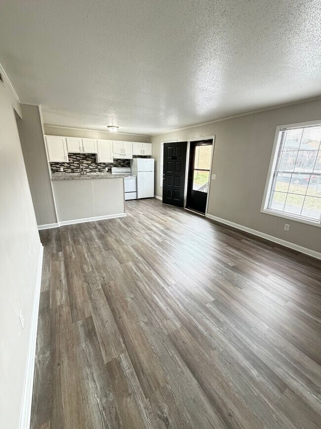 Building Photo - May Savings Are Here! Application Fee WAIVED ALL month!