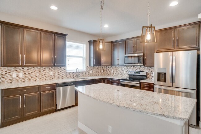 Building Photo - Stunning 3-Bedroom Pool Home with Bonus Room in the Gated Community of Lakeshore at Narcoossee