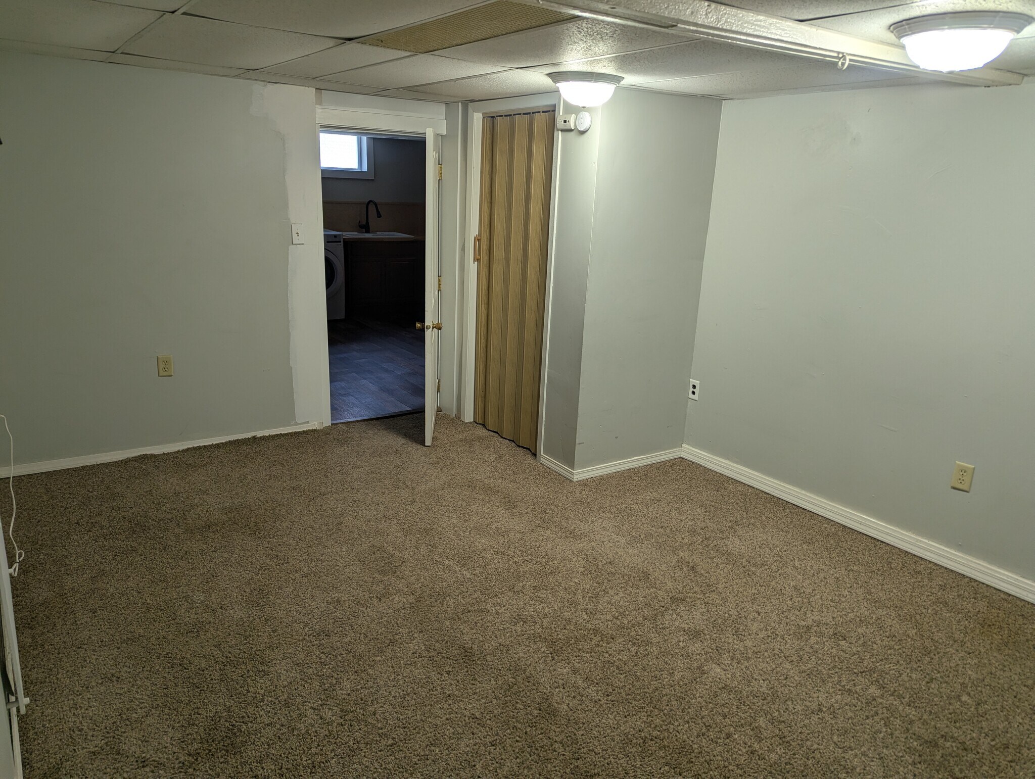 Second bedroom complete with closet. Fresh paint going up this week. - 906 Bethel St