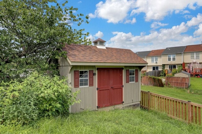 Building Photo - Spacious 4-Level Home with Deck, Workshop ...