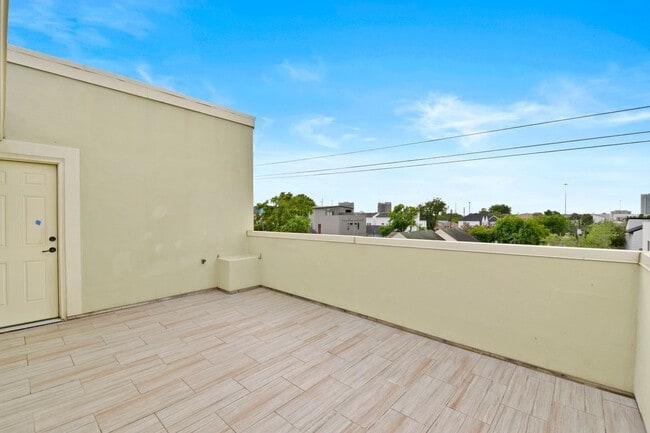 Building Photo - Light-Filled Corner Home with Rooftop Pati...