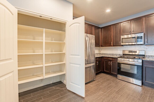Building Photo - Verrado Living - 4 Bedrooms & 3 Baths!