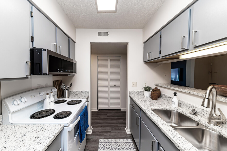 Kitchen with granite counters and modern cabinetry - The Manning