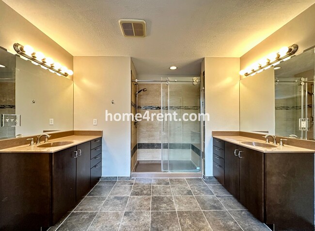 Building Photo - Beautiful Four-Bedroom Home with Three Car Garage, Wood Floors, Finished Basement and a Fenced Ya...