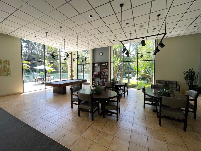Pool table & library at the clubhouse - 576 N Bellflower Blvd