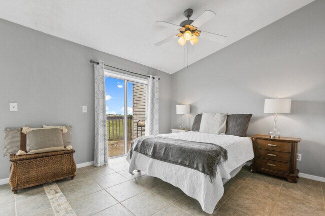 Primary bedroom with access to private 3rd floor deck - 574 Ryans Woods Ln