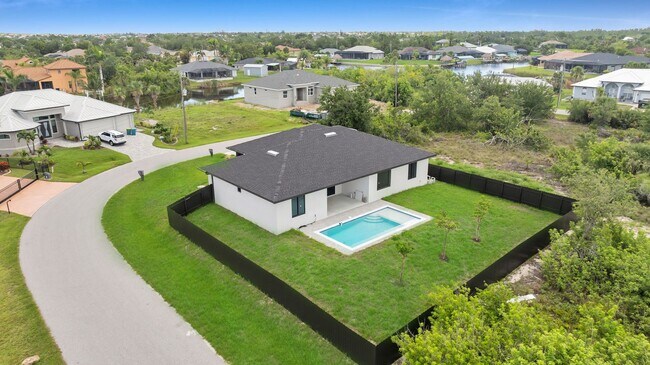 Building Photo - Brand-New Pool Home for Rent – Port Charlo...