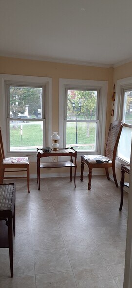 Enclosed porch with view of the park - 715 N McBride St