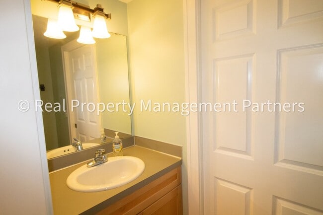 Building Photo - Spacious 3BR Townhome in Lowell | Nature Views & Maintenance-Free Living