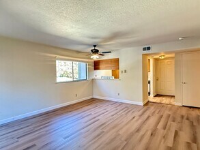 Building Photo - New Vinyl Plank Flooring, Fresh Interior Paint, 1 Car Garage + 1 Assigned Outdoor Parking Space -...