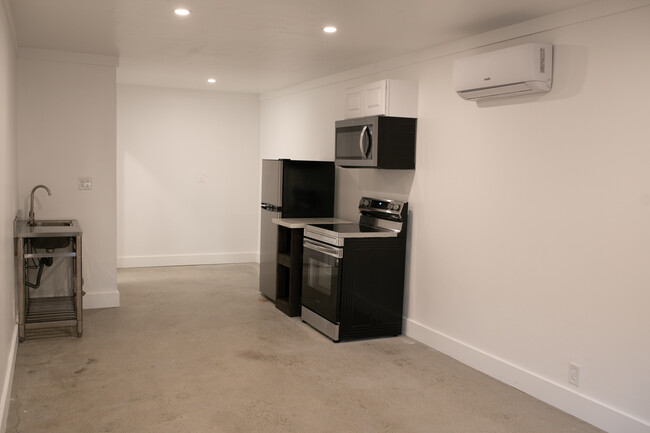 Kitchen and rear open area near bathroom - 660 E Pine Ave