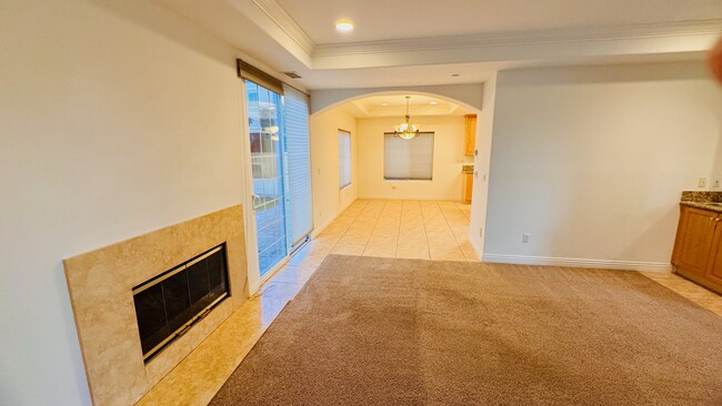 Living room with a very nice, granite fierplace - 2107 Plant Ave