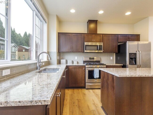 Building Photo - Neat and Tidy Newer Town Home with Two Master Bedrooms and Den on the Main Level