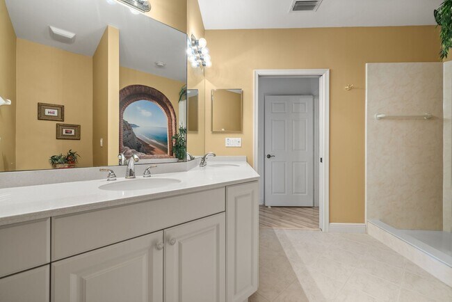 Building Photo - Experience Bell Tower Park. GATED ground floor 2 Bed 2 Bath Den 1 Car Garage Condo.