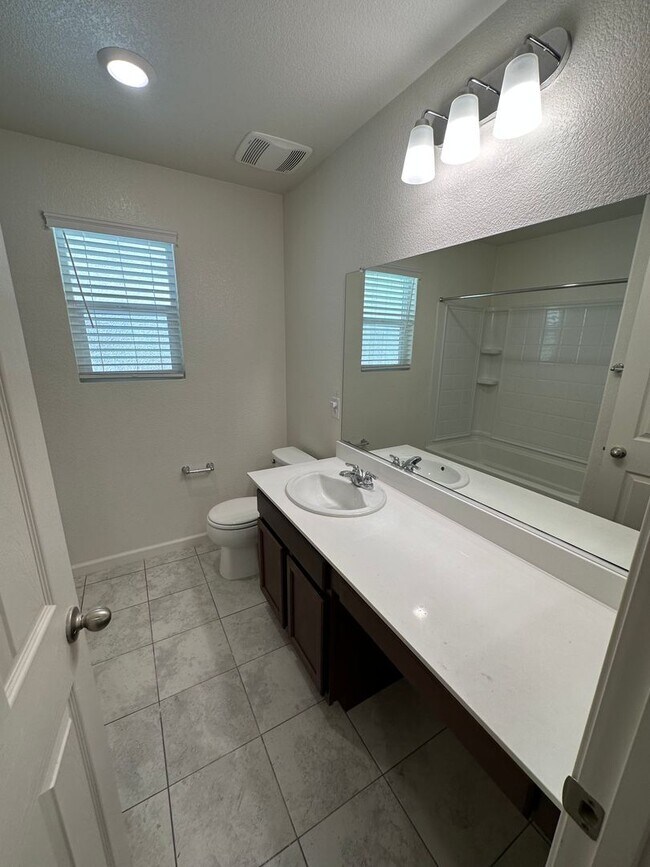 Building Photo - Stunning 4 Bedroom, 3 Bath Gated Community W/ Solar