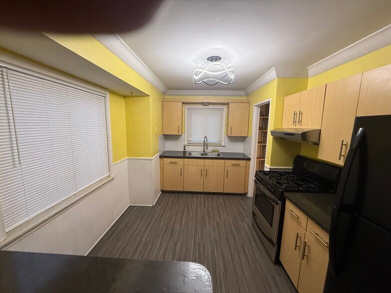 Kitchen with new flooring, fixtures, and fresh paint - 25200 leach st