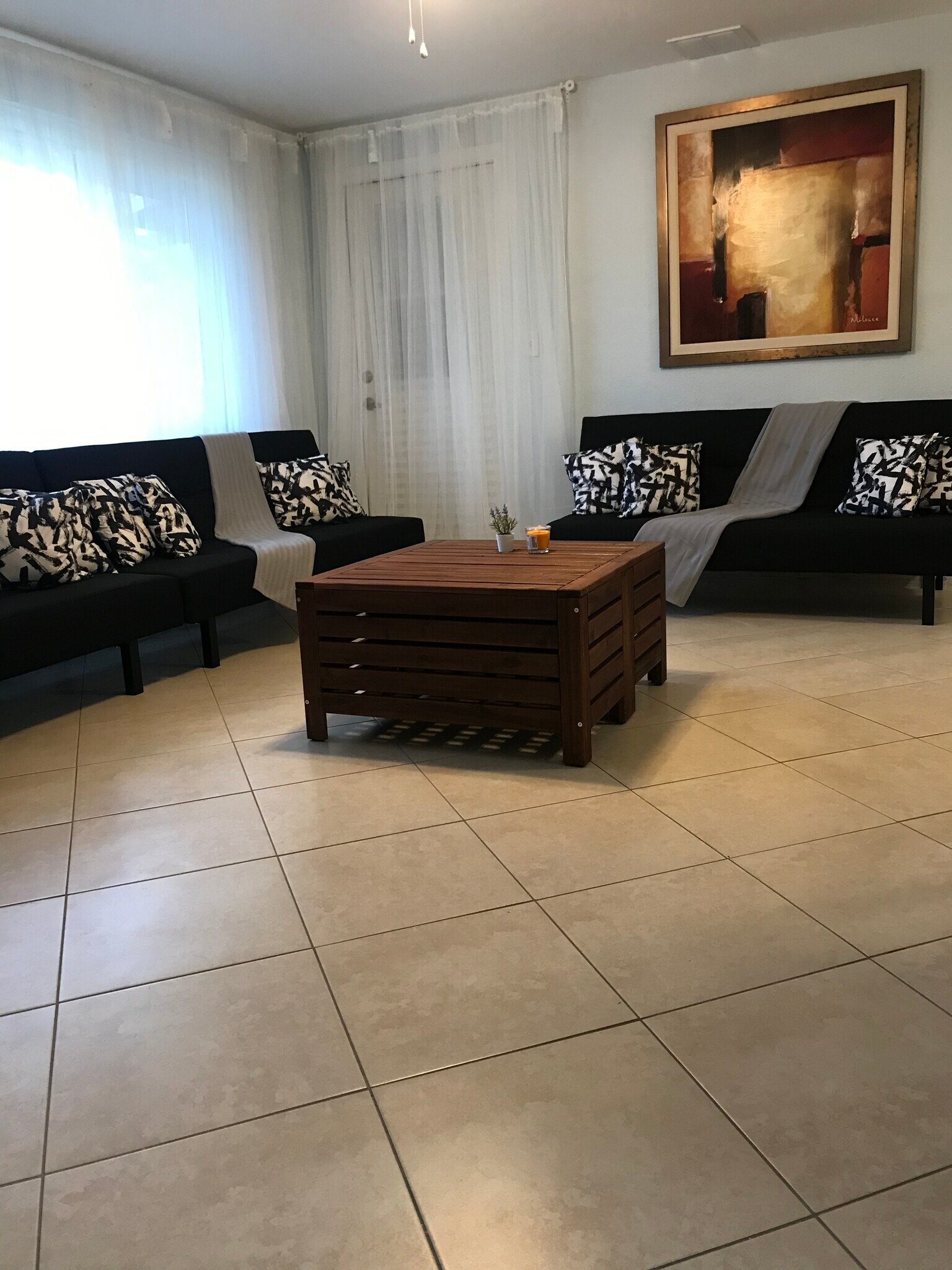 Living room with new furniture sleeping sofas. - 2440 Manasota Beach Rd