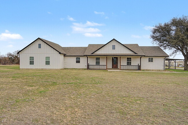 Building Photo - “Farmhouse Charm Meets Modern Luxury on a Serene 5-Acre Lot!”