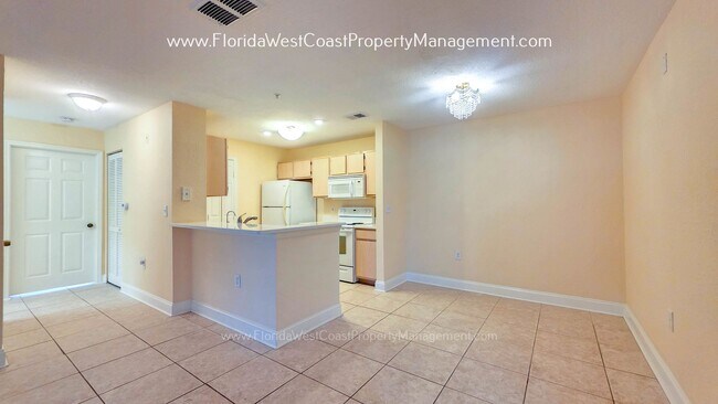 Building Photo - MOVE IN READY! LARGE 2 BEDROOM/2 BATH PLUS ATTACHED GARAGE! TILE/LVP THROUGHOUT!