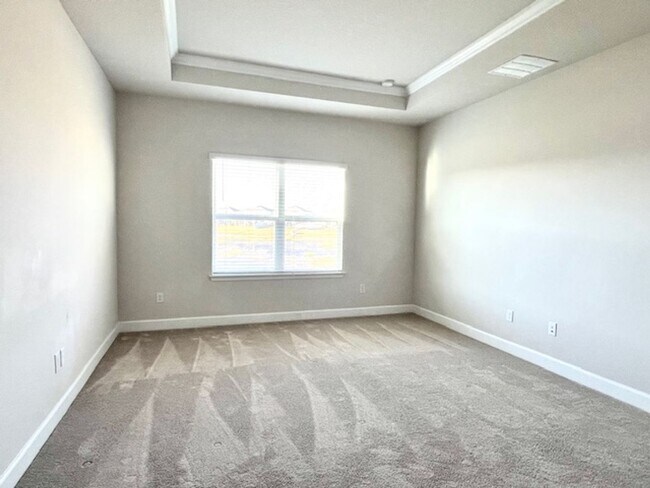 Building Photo - Open concept home offering four bedrooms, three baths, a two car garage and open lanai.