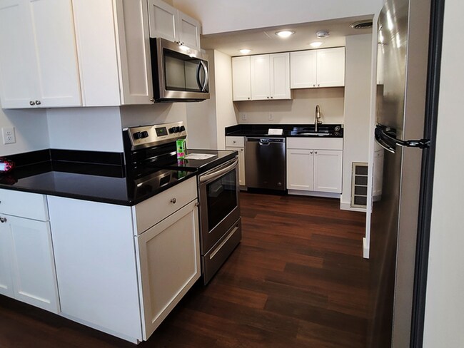 The Burgundy kitchen - 211 Springfield Apartments