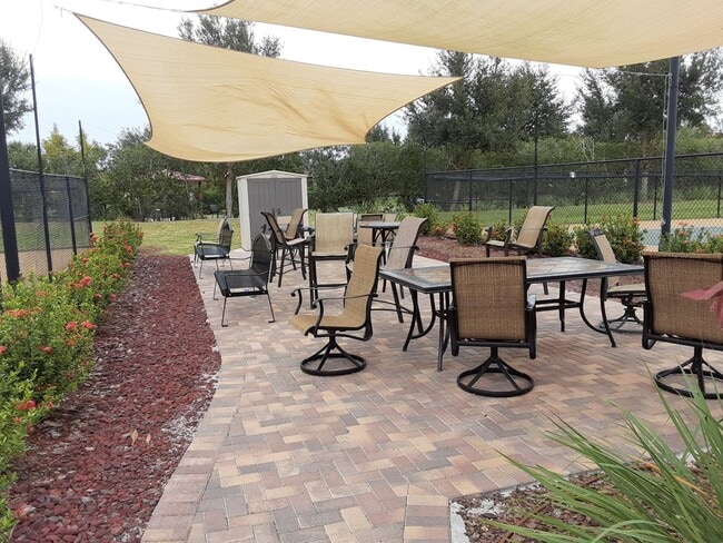 Building Photo - Seasonal/short term turnkey furnished Incredible 2/2 with den ground floor condo in resort Esplan...