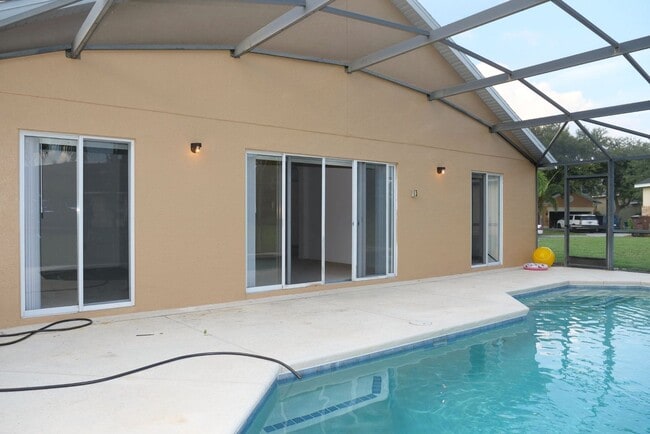 Building Photo - 4 Bedroom Pool Home Available Now!