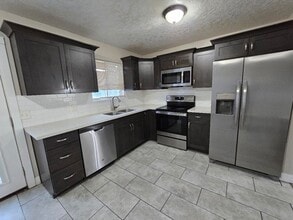 Building Photo - Spacious 5-Bedroom Magna Home with Deck and Ample Parking