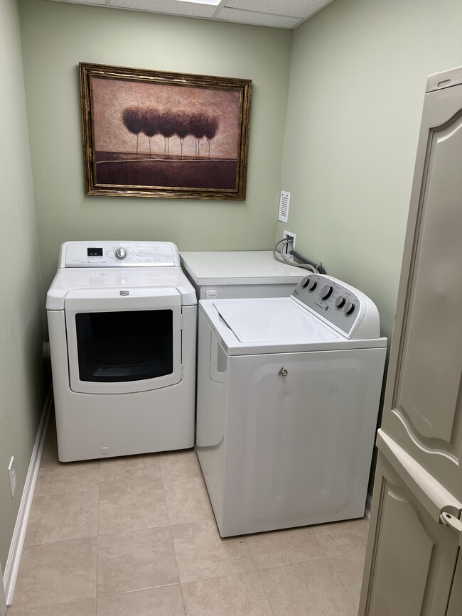 Laundry room with storage. - 3617 Sunset Rdg