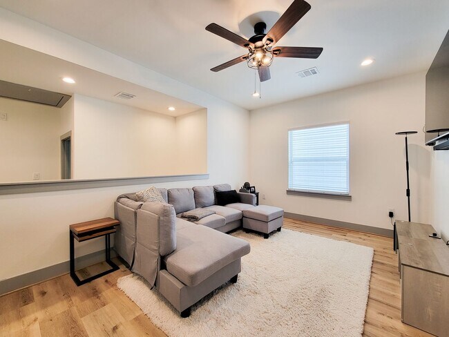 Building Photo - This 4-bedroom, 3-bathroom, two-story residence comes with a generous two-car attached garage. Re...