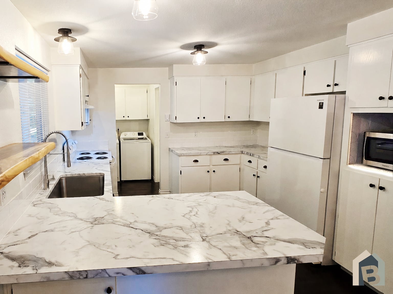 Brand new kitchen countertops, stove, stainless sink, faucet, tile, and microwave - 20981 Port Gamble Rd NE