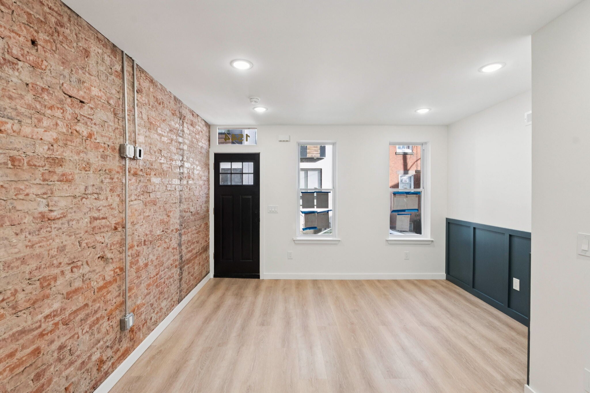 Open living space with exposed brick - 1544 S Bambrey St