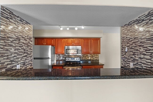 Building Photo - SE!!! Gated!! 1 Bedroom 1st Floor!! One Car Garage!!! Community Pool, Spa, Clubhouse!!! All tile ...