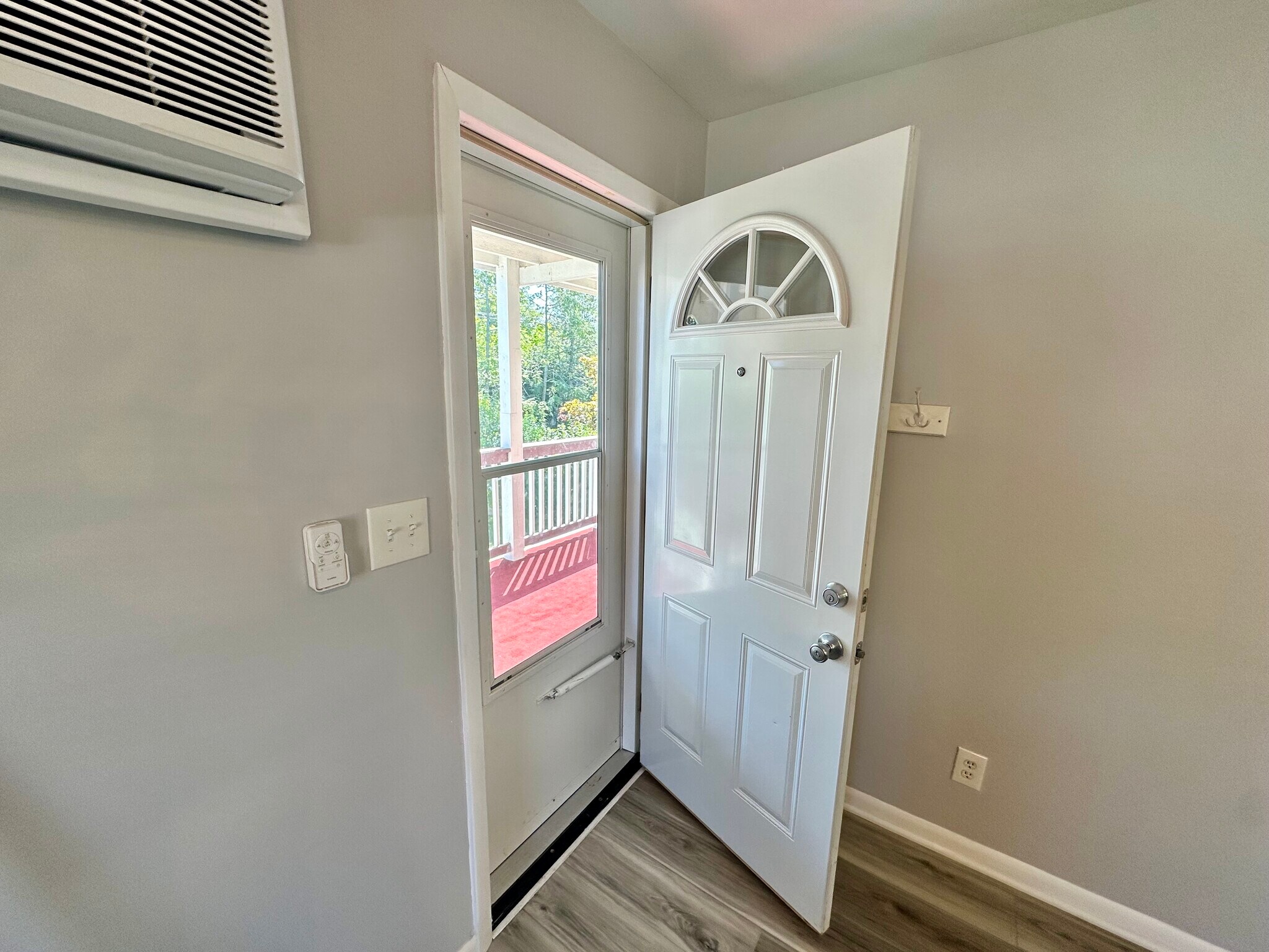 Steel case door leading to outdoor carpeted balcony - 671 56th St