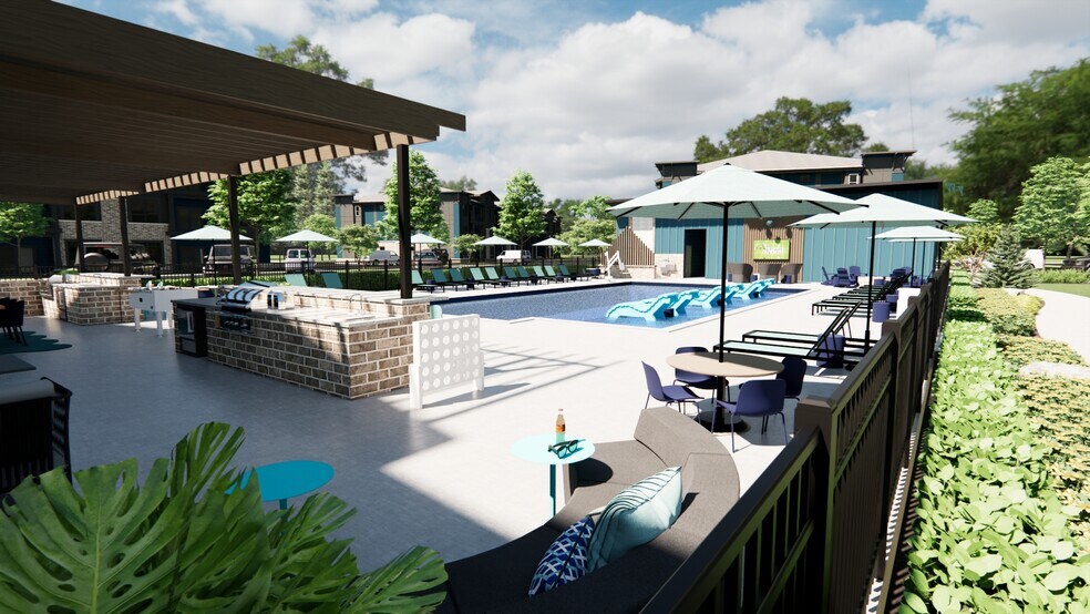 Outdoor Kitchen, lounge, and gaming center - Cypress Point Luxury Apartments