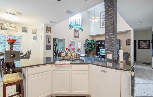 KITCHEN OVERLOOKS LIVING ROOM - 14935 Turret Run