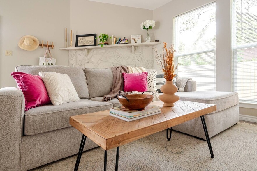 Living room with Fireplace, large window and new blinds throughout - 6307 Okner Ln