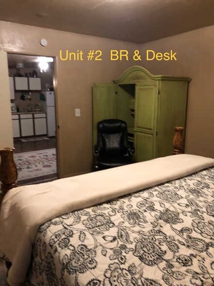 King Sized Bed w/Desk in the background - 450 Stevens Ave